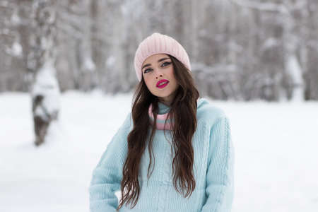 Stylish young lady in winter countryside