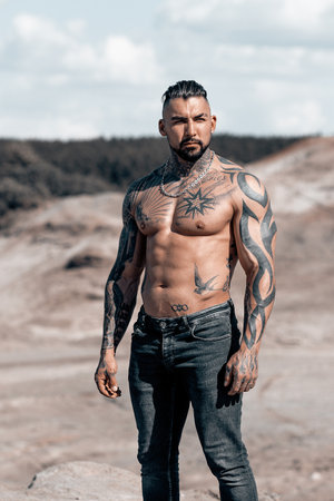 Sexy portrait of handsome muscular topless male model at the beach.の写真素材