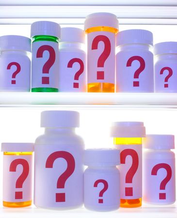 Close crop of medicine cabinet shelves filled with pill bottles, each labeled with a red question mark. の写真素材