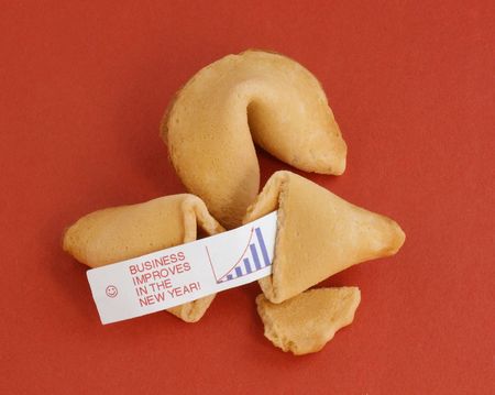 Two fortune cookies on a red background. One is opened, showing a fortune saying, の写真素材