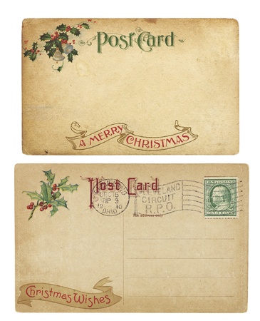 Two aging Christmas time postcards from 1910, isolated on white. の写真素材