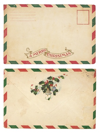 The front and back of an aging Christmas envelope with red and green striped border. の写真素材