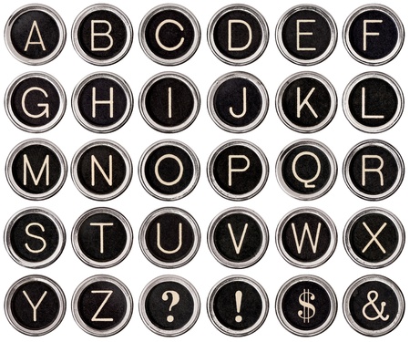 Full alphabet of vintage typewriter keys including dollar sign, ampersand, exclamation and question marksの写真素材
