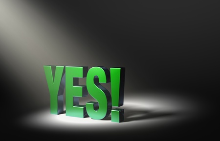 Angled spotlight highlighting shiny green  YES   on a dark background の写真素材