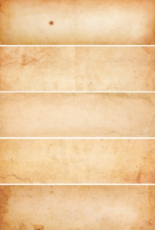 Collection of five heavily aged and water stained blank paper banners.  Isolated on white.の写真素材