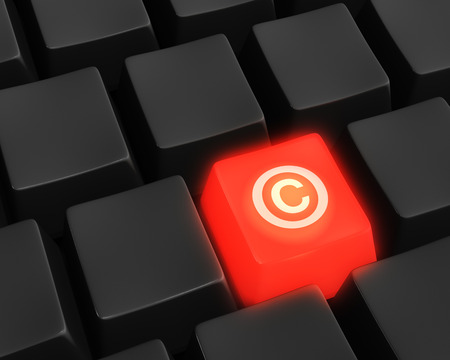 Close up photo-real illustration of unlabeled, black computer keyboard keys surrounding a single red glowing key labeled with the copyright symbol の写真素材