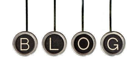 Four old, scratched chrome typewriter keys with black centers and white letters spelling out the word,  BLOG    Isolated on white の写真素材