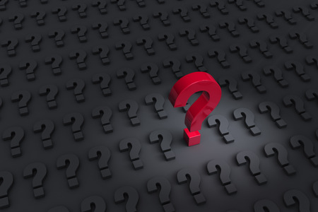 A big, red question mark stands up and dominates a dark field of gray question marks laying flat.の写真素材