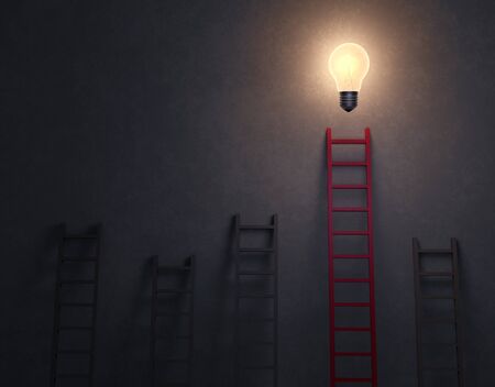 3d illustration of several gray ladders leading nowhere and leaning against a dark, concrete background. A red ladder, reaching higher than the rest, leads to a brilliant lightbulb glowing overhead. の写真素材