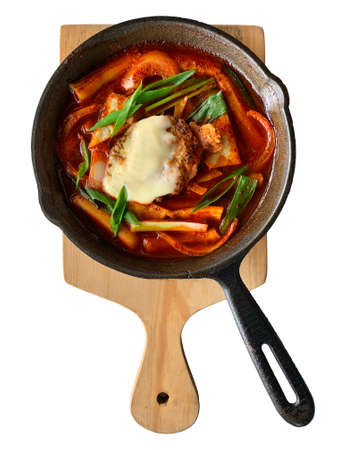 Korean food. Spicy chicken cheese with sauce. Isolated white background.の写真素材