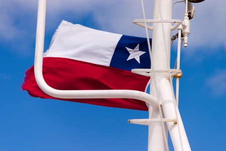 Chilean flag on a ferry boat in strait of magellanの写真素材