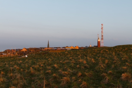 Evening mood on Helgoland with lighthouse and churchの写真素材