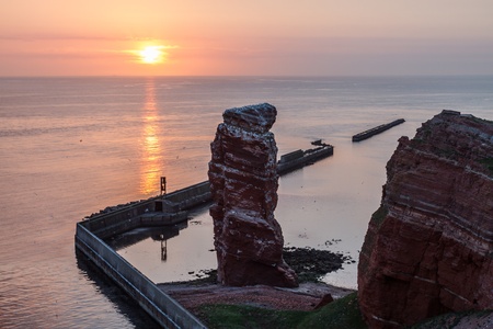 Sundown on Helgoland with Lange Anna and calm seaの写真素材
