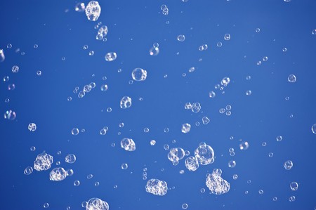 Soap bubbles before blue sky
