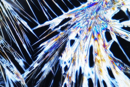 Microphoto of microcrystals in polarized lightの写真素材
