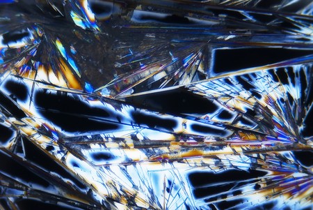 Microphoto of microcrystals in polarized lightの写真素材
