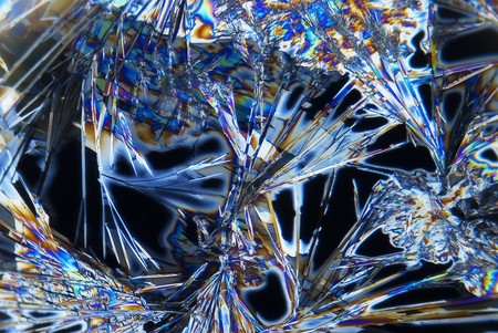 Microphoto of microcrystals in polarized lightの写真素材