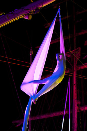 KIEL, GERMANY - JULY 18: Polish acrobat group "Ocelot" in the  rigging of sailing ship "Fryderyk Chopin" on the occasion of "Chopin / Polska / The Course" Tour in Kiel, July 18, 2010 in Kiel, Germanyのeditorial素材