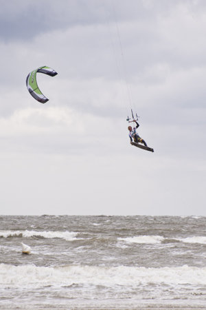 ST. PETER-ORDING, GERMANY - JULY 24: Professional kite-surfers demonstrating their ability on the Palmolive Kitesurf Worldcup 2010 in St. Peter-Ording, July 24, 2010 in St. Peter-Ording, Germanyのeditorial素材
