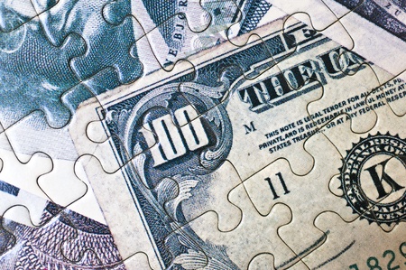 Close up of a money puzzleの写真素材