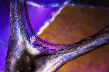Micro photo of burnt adhesive film in polarized lightの写真素材