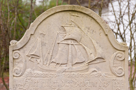 AMRUM, GERMANY - DECEMBER 31, 2014: In Nebel on the North Frisian Island Amrum in Germany the historic Sailor Tombstones have been restored. They are called speaking Grave Stonesのeditorial素材