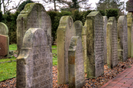 AMRUM, GERMANY - DECEMBER 31, 2014: In Nebel on the North Frisian Island Amrum in Germany the historic Sailor Tombstones have been restored. They are called speaking Grave Stonesのeditorial素材