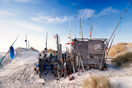 AMRUM, GERMANY - DECEMBER 29, 2014: On the Kniepsand Beach of  the North Frisian Island Amrum in Germany Land-Artists made Beach Huts and other Objects out of Flotsam and Jetsamのeditorial素材