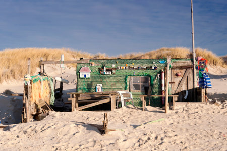 AMRUM, GERMANY - DECEMBER 29, 2014: On the Kniepsand Beach of  the North Frisian Island Amrum in Germany Land-Artists made Beach Huts and other Objects out of Flotsam and Jetsamのeditorial素材