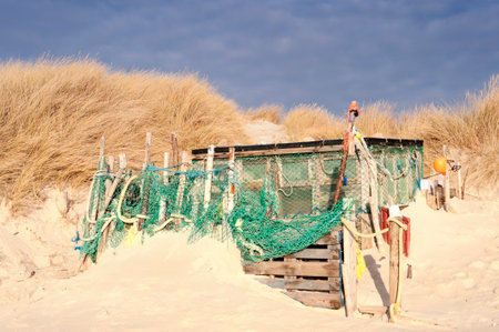 AMRUM, GERMANY - DECEMBER 29, 2014: On the Kniepsand Beach of  the North Frisian Island Amrum in Germany Land-Artists made Beach Huts and other Objects out of Flotsam and Jetsamのeditorial素材