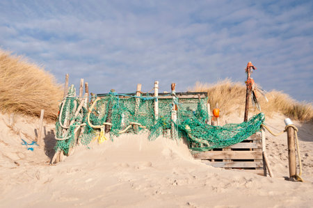 AMRUM, GERMANY - DECEMBER 29, 2014: On the Kniepsand Beach of  the North Frisian Island Amrum in Germany Land-Artists made Beach Huts and other Objects out of Flotsam and Jetsamのeditorial素材