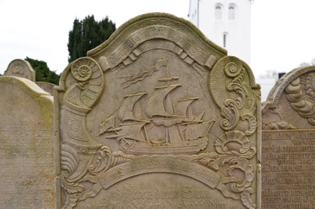 AMRUM, GERMANY - DECEMBER 31, 2014: In Nebel on the North Frisian Island Amrum in Germany the historic Sailor Tombstones have been restored. They are called speaking Grave Stonesのeditorial素材