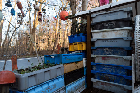 AMRUM, GERMANY - JANUARY 02, 2018: Fishing crates, buoys and other maritime objects in front of the old bar Blaue Maus on the North Frisian island Amrum in Germanyのeditorial素材