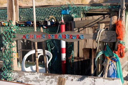 AMRUM, GERMANY - JANUARY 02, 2018: On the Kniepsand Beach of  the North Frisian Island Amrum in Germany Land-Artists made Beach Huts and other Objects out of Flotsam and Jetsamのeditorial素材