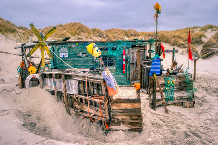 AMRUM, GERMANY - DECEMBER 28, 2018: On the Kniepsand Beach of  the North Frisian Island Amrum in Germany Land-Artists made Beach Huts and other Objects out of Flotsam and Jetsamのeditorial素材