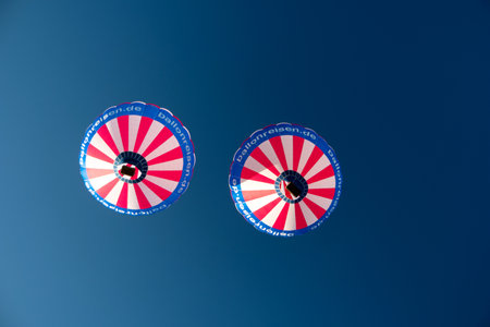 KIEL, GERMANY - JUNE 22, 2019: During the Kieler Woche 2019 Hot Air Balloons take off at the International Willer Balloon Sail.  Illustrative editorialのeditorial素材