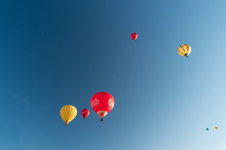 KIEL, GERMANY - JUNE 22, 2019: During the Kieler Woche 2019 Hot Air Balloons take off at the International Willer Balloon Sail.  Illustrative editorialのeditorial素材
