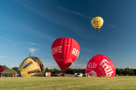 KIEL, GERMANY - JUNE 22, 2019: During the Kieler Woche 2019 Hot Air Balloons take off at the International Willer Balloon Sail.  Illustrative editorialのeditorial素材