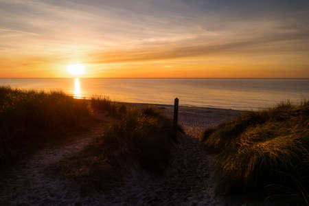 Sunset on the beach of Ahrenshoop in Germanyの写真素材