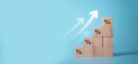 Wooden blocks with percentage sign,represent in meanings of interest rate increase,  performance increase, sales increase, business growth , percent growthの写真素材