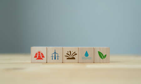 Renewable and green energy concept. Eco evolution for saving the world. Wooden cubes with clean...