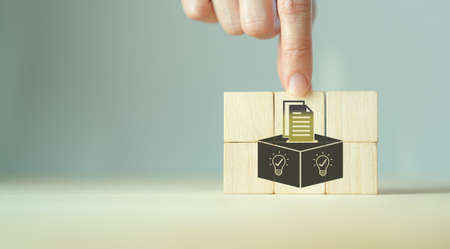 Suggestion and feedback concept. New idea, solution. Wooden cubes with suggestion box, card holder...