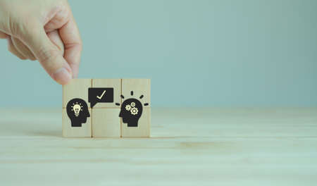Suggestion and consulting concept.  New idea, solution. Putting wooden cubes with recommend to...