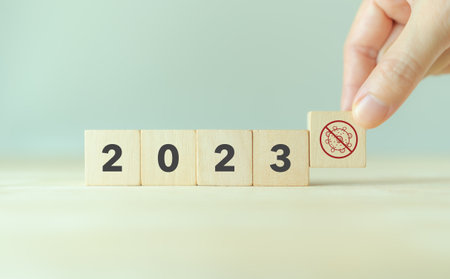 2023 Zero Covid-19 concept. Coronavirus virus cell symbolic. Wooden cubes with ZERO COVID icon on smart background and copy space. Zero Covid-19 and medical concept.の写真素材