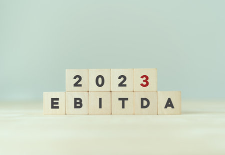 EBITDA in 2023 - Earnings Before Interest, Taxes, Depreciation and Amortization. Business, financial, money investment profit concept on wooden cubes. Bussiness goals, plan and achievement in 2023.の写真素材