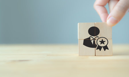 Personal development and career growth concept, hand putting wooden cubes with career promotion icon and the concept of development icons. Learning, performance and competency development.の写真素材