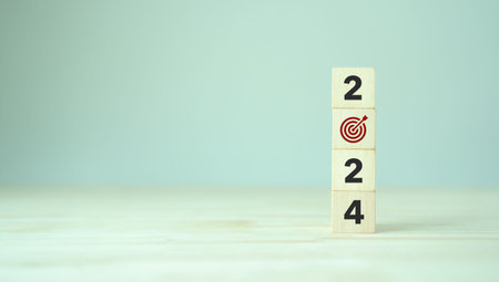2024 goals of business or life. Wooden cubes with 2024 and goal icon on smart background. Starting to new year. Business common goals for planning new project, annual plan, business target achievementの写真素材