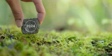 2024 Green business, enviromental sustainability. Carbon offset and neutrality strategies. Saving environment, clean planet and ecology. 2024 text on green natural view backgroundの写真素材