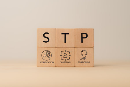 Segmentaion, targeting, positioning STP Marketing Model. Wooden blocks with STP icons.  Identify different customer groups, select groups to prioritize, and create unique value proposition.の写真素材