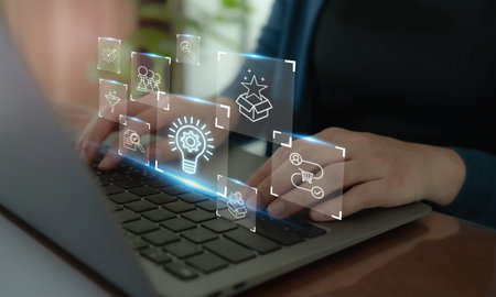 Creative idea generation for new product development concept. Creative thinking and innovation. Using laptop with stages of innovation icons, generating creative idea process for product developmementの写真素材